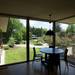 Floor-to-ceiling windows line the upper level of the house. Here they over look the yard offering an incredible view.  Melanie Maxwell | AnnArbor.com